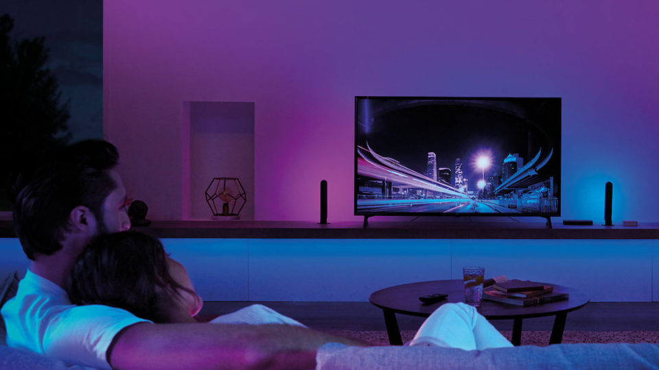 Sync your lights with your TV and the Philips Hue Play HDMI Sync Box to create seamless surround lighting.